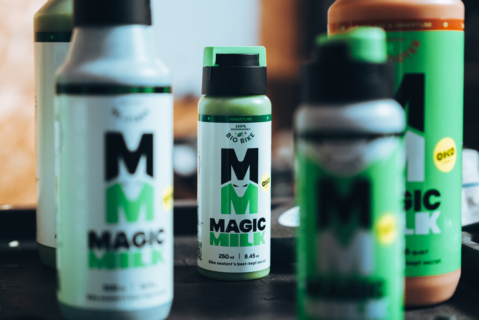 A range of Magic Milk tyre sealant bottles